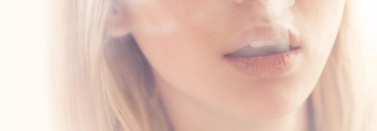 DOSAGE: Young woman smoking